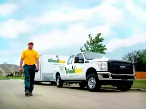 Grounds Guys arriving to start trimming a tree down