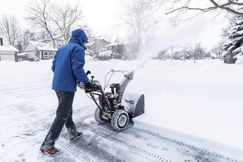 Man using a snow blower