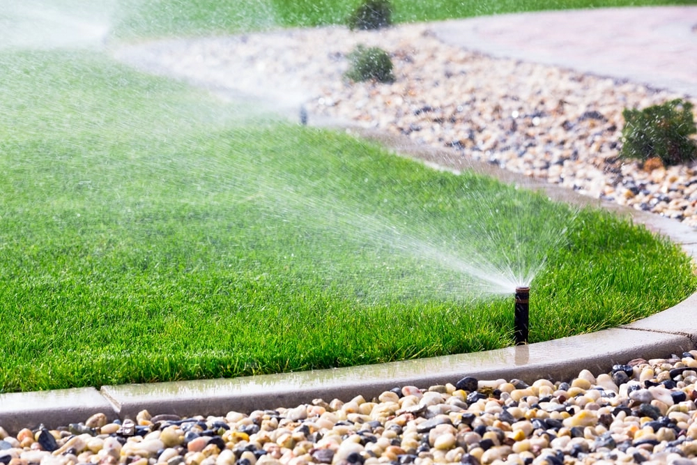 Automatic sprinkler system watering grass