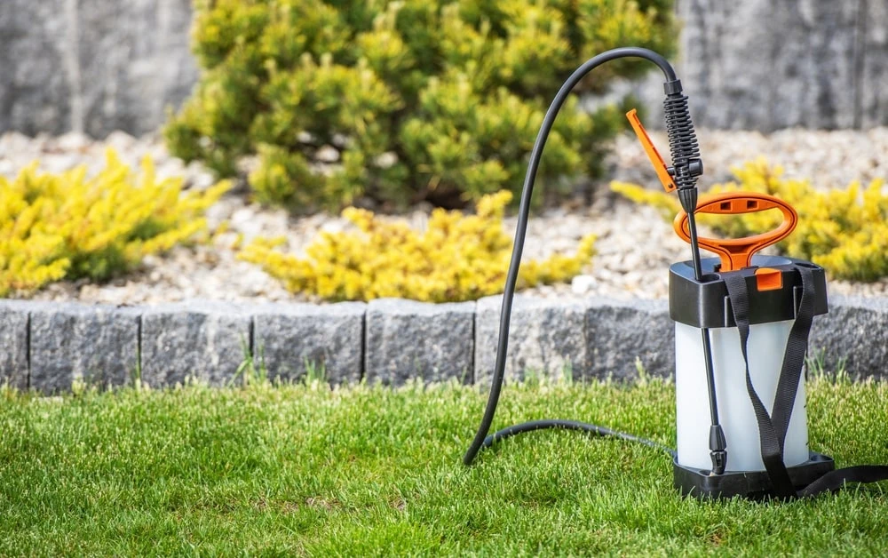 Liquid fertilizer equipment on a lawn.