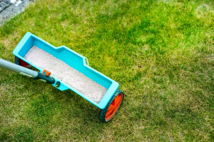 Fertilizer spreader on grass.