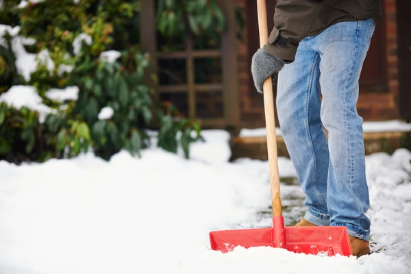 Man shoveling snow | The Grounds Guys of Gettysburg