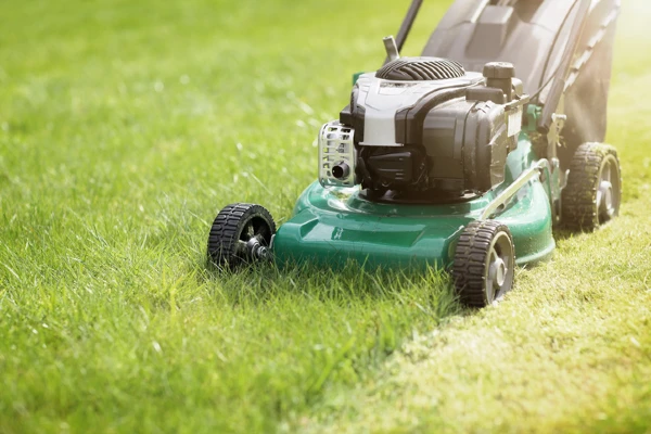 lawn mower mowing grass