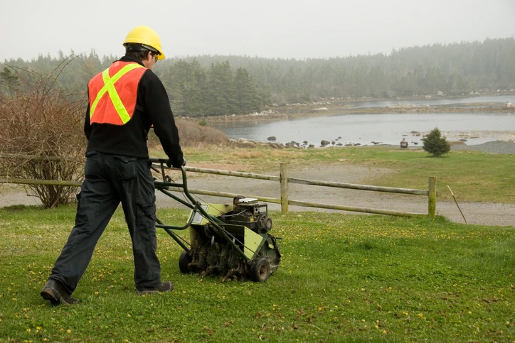 Landscaper aerating a lawn | The Grounds Guys of Gettysburg