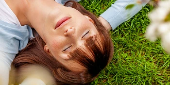 Woman resting on a lawn