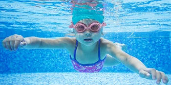 Child swimming in a pool